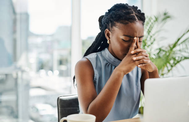 A woman feeling high blood pressure
headaches and stress