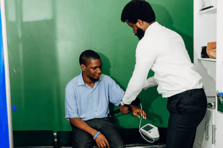 Young Man checking for high blood pressuure or hypertension in nigeria