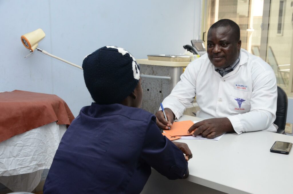 10 Early Signs of Diabetes in Nigeria You Should Never Ignore Nigerian healthcare professional discussing diabetes screening and complications with a patient